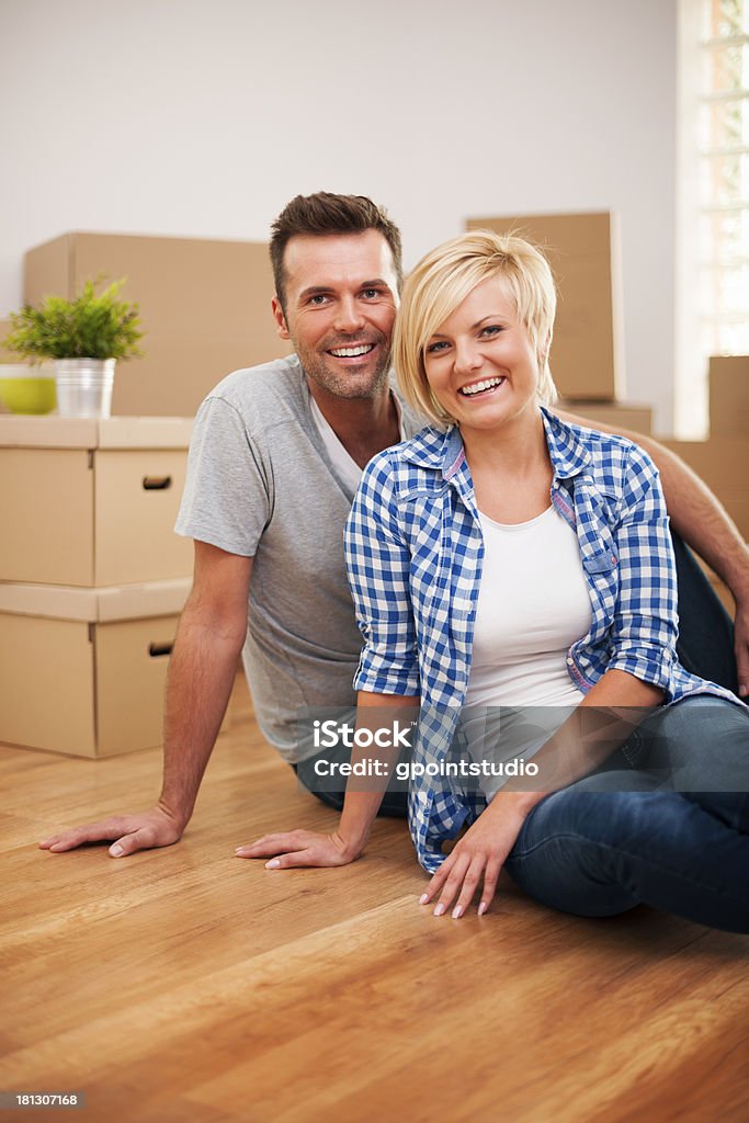 Portrait of attractive couple in new house Adult Stock Photo