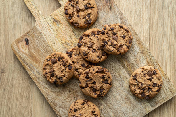 istock Chocolate chip cookies on a wooden background. 1813088283