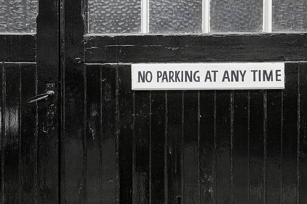 istock No Parking on a black painted garage door 181309038