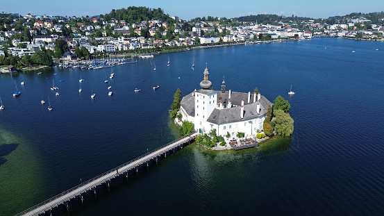 The Ort lake castle on an island on Lake Traunsee in Gmunden photographed from the air, Salzkammergut, Austria