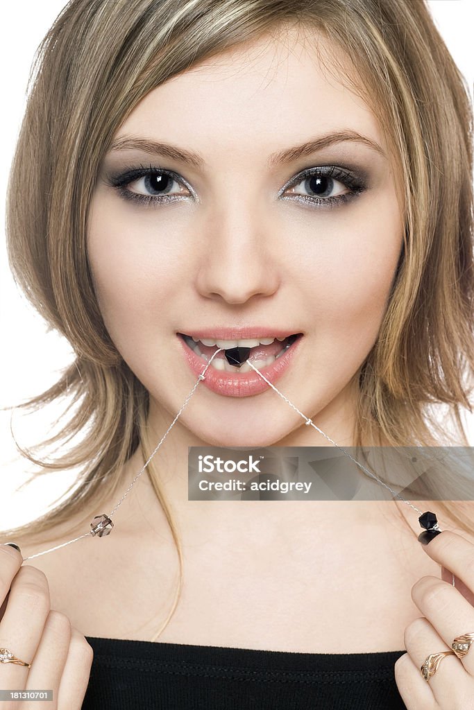 Portrait of perfect young woman Portrait of perfect young woman with a bead in her mouth Adult Stock Photo