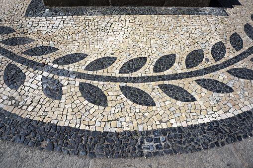 Olive Branch Pattern in Traditional Mosaic Paving Tiles on a Street of Aveiro, Portugal.