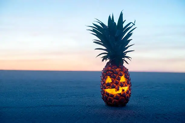 Photo of Halloween on Beach. Pinapple jack o lantern