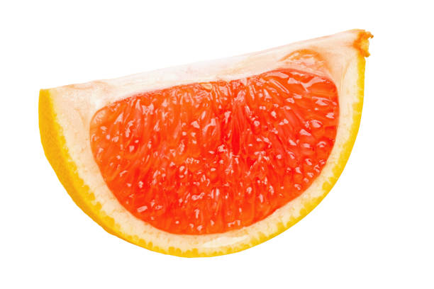 Ripe slice of pink grapefruit citrus fruit isolated on white background. File contains clipping path. Full depth of field.