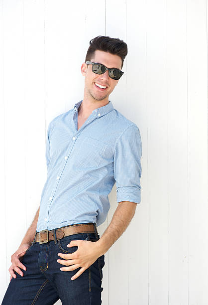 istock Handsome young man smiling with sunglasses 181313711