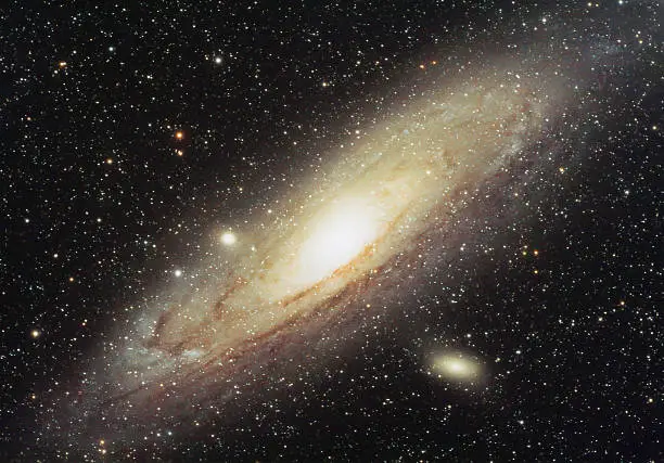 Great Andromeda spiral galaxy (Messier 31) is one of the most further objects in the night sky that can be seen with a naked eye with it's distance of aprox. 2.5 million light years. This is a long exposure photo combined with a high quality astronomical telescope.