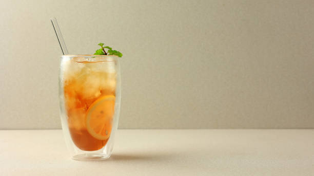 istock Lemon Tea on Double Wall Glass with Mint Leaf Topping 1813163591