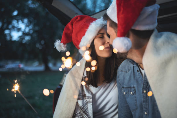 istock Happy Couple Making Christmas Special in the Trunk 1813171410