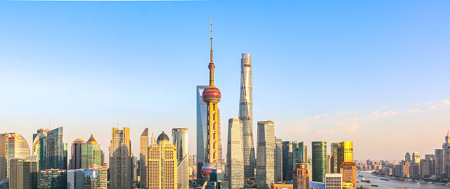 Iconic Shanghai cityscape and skyline, featuring the Oriental Pearl Tower, Shanghai Tower and Shanghai World Financial Center at sunset - China