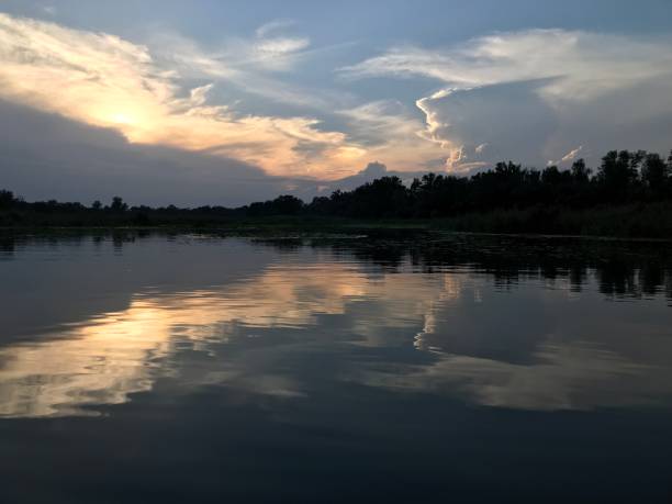 istock Sunset over the river in summer 1813182279