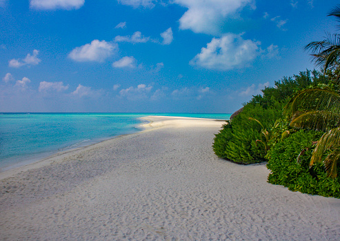 Maldives beach with blue sky and clouds