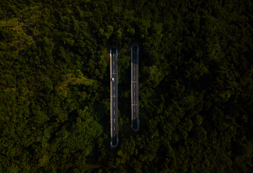 Beautiful view from the drone point of view of the highway surrounded by green vegetation