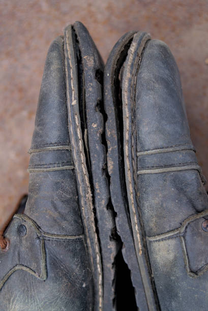istock Photo of old torn leather shoes 1813223524