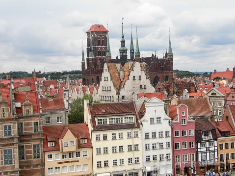 Gdansk waterfront boardwalk historical buildings church tower architecture old city town market square river Poland