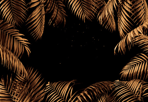 Golden palm leaves frame over black background.