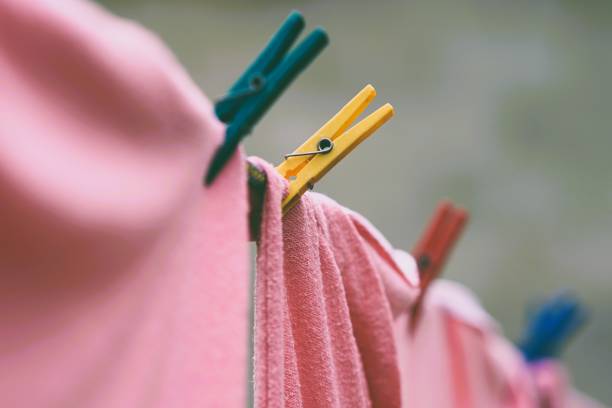 istock pink bedding is dried on a rope with plastic clothespins 1813253199