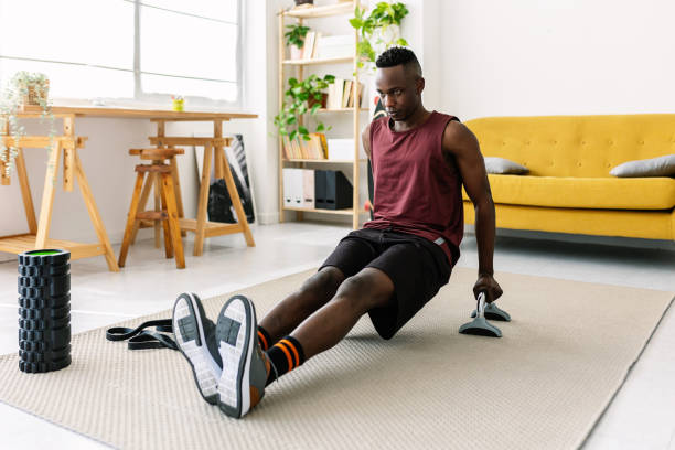 istock Young adult african man training at home 1813256434