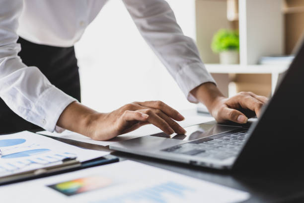 istock Businesswoman analyzing business reports and financial data on laptop. 1813258328