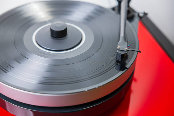 istock Vinyl record spins on Hi-Fi turntable, sparking nostalgia with its timeless melody. 1813261257
