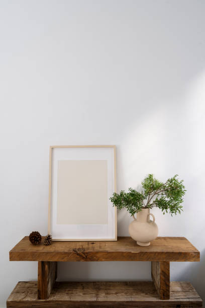 istock Stylish interior composition with wooden bench and mockup picture in frame 1813264989