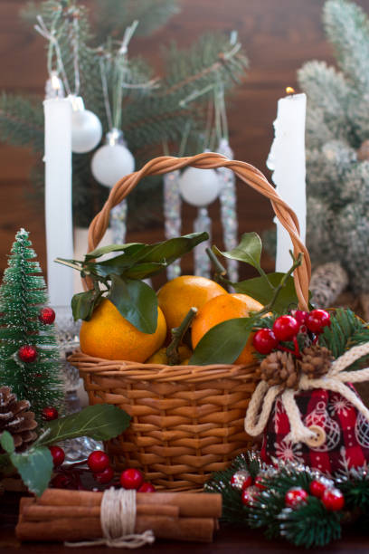 istock New Year's tangerines in a wicker basket. Festive atmosphere 1813266422