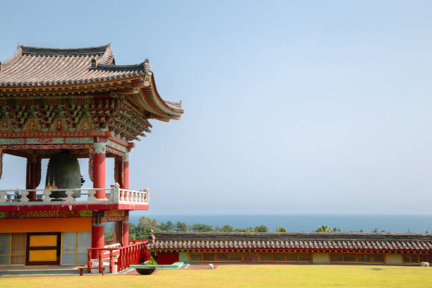Yakcheonsa Temple and sea view in Jeju Island, Korea stock photo