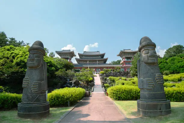 Yakcheonsa Temple and Dol hareubang in Jeju Island, Korea