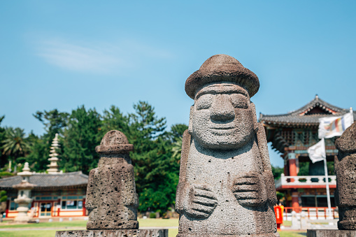 Yakcheonsa Temple and Dol hareubang in Jeju Island, Korea