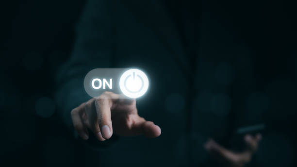 istock A businessman is shown in the act of touching a virtual toggle switch button, which is used to turn a device on or off. Slider button hologram, Startup business, 1813297441