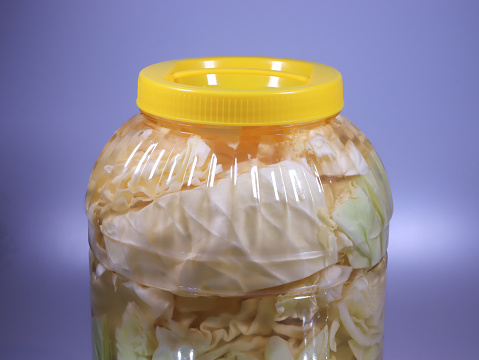 cabbage pickle in jar with yellow cover