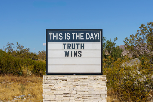 Letter marquee sign that reads: This is the day! Truth Wins.