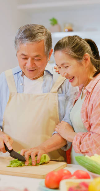 istock Asian elderly couple in kitchen 1813305227