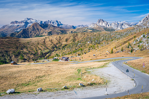 Panoramic view of a mountain road in the Italian Dolomites. View is from the Giau Pass in westerly direction.
