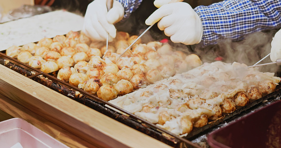 close up vendor make takoyaki - asia travel in korea seoul myeongdong