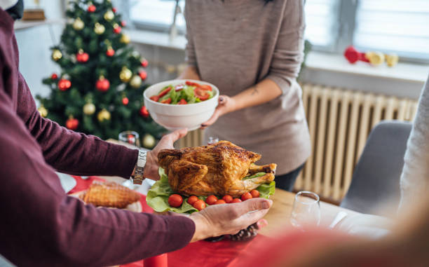 istock Couple setting up the table for Christmas lunch 1813356863