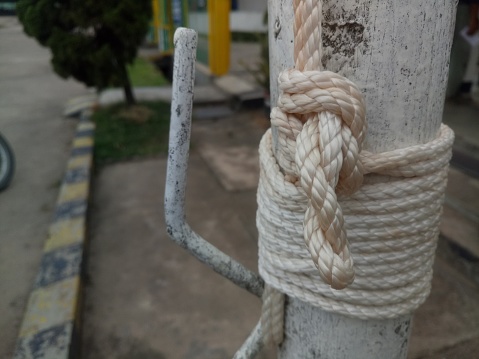 close-up view of rope fastening the flag to the pole