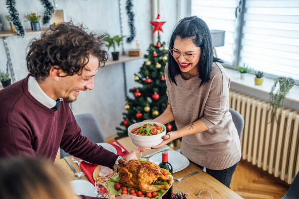 istock Friends setting up the table for Christmas lunch 1813367365