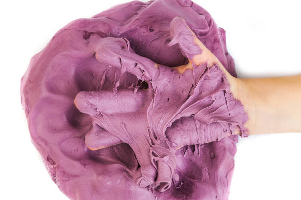 istock Children's hand in purple slime. 1813399758
