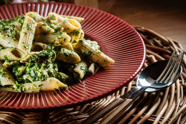 istock Penne pasta with spinach and chicken. 1813408732