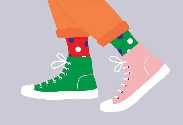 Vector illustration of Shoe pair, boots, footwear. Walking in sneakers with colored socks and jeans.