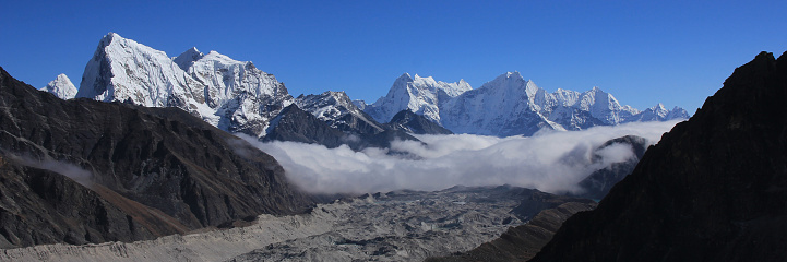 The jagged snow capped peaks of Thamserku 6608m soaring high in the Himalayan mountains of Nepal.