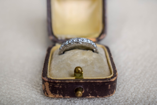 Close-up of the wedding rings of the bride and groom in a box