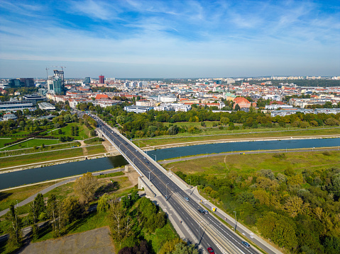 Aerial landscape of Warta river, Queen Jadwigi bridge and distant Poznan city center