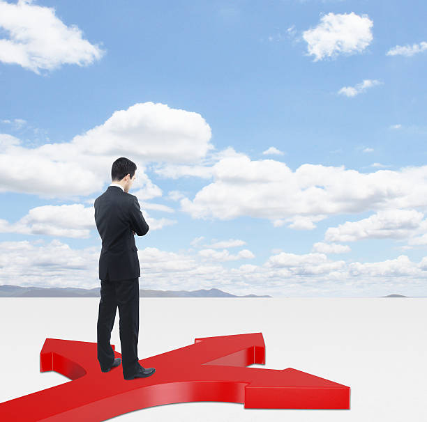 istock businessman and red arrows 181347829