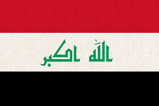 flag of Iraq. National Iraqi flag on fabric surface. Iraqi national flag on textured background. Fabric Texture. Republic of Iraq. Asian country. State symbol of Iraq