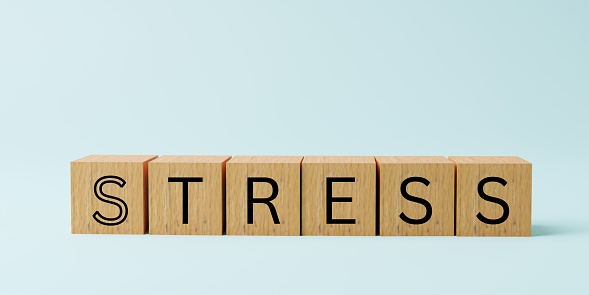 Stress text. Wooden cubes on plain light blue background with copy space. Stress Concept. Minimal 3D illustration.