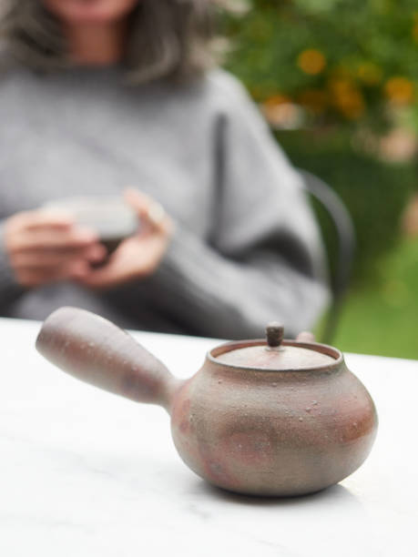 istock traditional side-handle Japanese clay teapot called kyusu. 1813494583