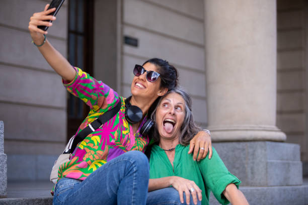 istock Two female tourists walking through the city 1813494591
