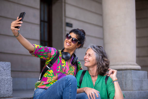 istock Two female tourists walking through the city 1813494894