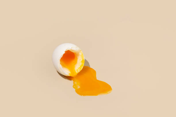 istock Runny yolk on a beige background 1813496765